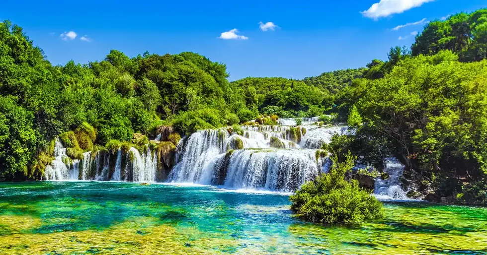 View over the travertine cascades of Skradinski Buk from the forest trail on the Gray Line Krka waterfalls day tour from Split and Trogir